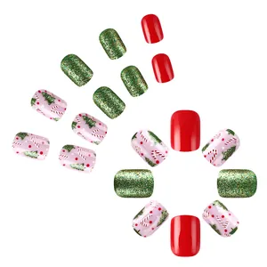 Glossy Christmas press-on nails featuring red, glitter green, and candy cane tree patterns