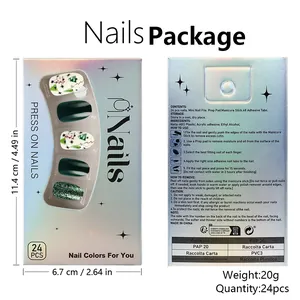 Glossy Christmas press-on nails set with festive trees and stars in silver laser packaging