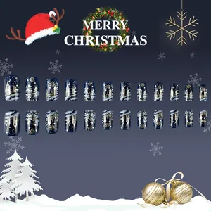 Short square press-on nails featuring dark blue Christmas castle and snowflake patterns