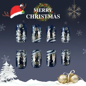 Detail view of glossy Christmas press-on nails with blue starry night and snowy castle art