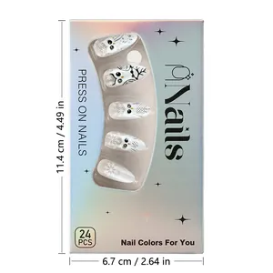 Short almond press on nails set with owl and snowflake design in holographic packaging