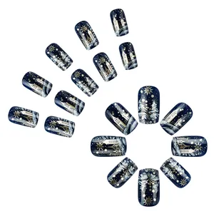 Short square press-on nails with blue starry sky and Christmas castle snowflake designs
