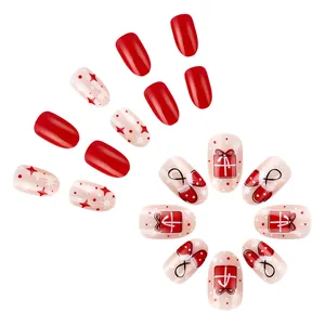 Short round Christmas press-on nails featuring red stars and festive gift box designs