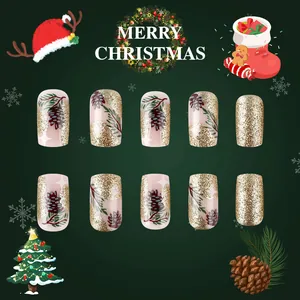 Detailansicht der Weihnachts-Nagelsets mit Pinienzapfen-Design und goldener Glitzer-Optik