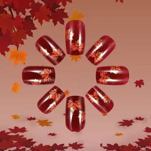 Short dark red press-on nails with autumn maple leaf patterns and fine glitter finish