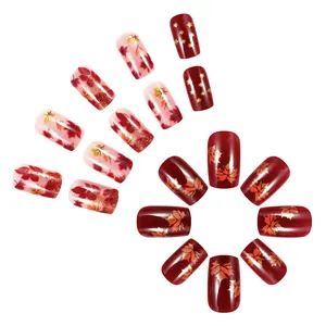 Short square-oval glitter press-on nails with dark red maple leaf and gold star designs