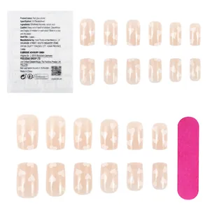Lot de 24 faux ongles brillants couleur chair avec cœurs blancs, colle et lime