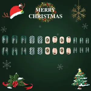 Christmas short press-on nails with holly berries, snowflakes, and green glitter stripes