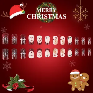Short square Christmas press-on nails with red glitter, snowflakes and gingerbread design
