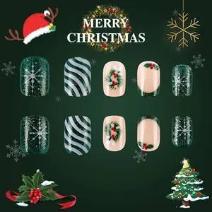 Christmas themed press-on nails with holly berries, snowflakes, and festive glitter patterns