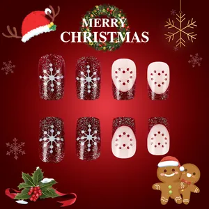 Detail of Christmas press-on nails with red snowflakes, hearts and silver glitter