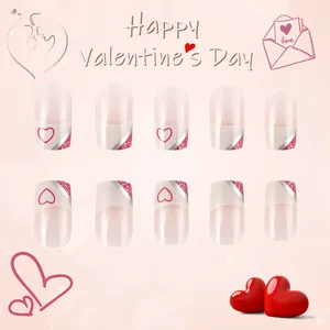 Detail of short French tips with red hearts and pink glitter for Valentine's Day