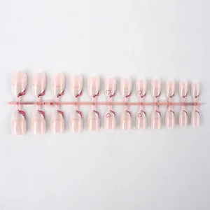 Detailed view of 24 pieces short glossy Valentine's Day press-on nails with red heart patterns