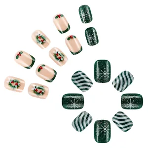 Christmas press-on nails with green holly motifs, white snowflakes and festive glitter stripes