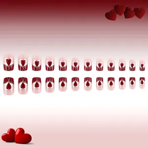 Full set of red heart press-on nails with silver outlines on pink French tips