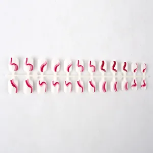 Detailed view of 24pcs short square press-on nails with white base and pink wavy lines
