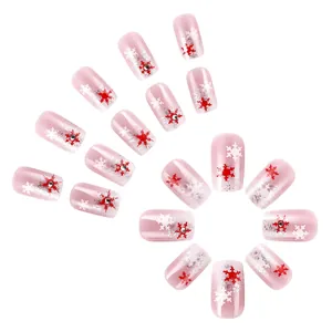 Unghie finte quadrate corte rosa e argento con fiocchi di neve natalizi e strass lucidi