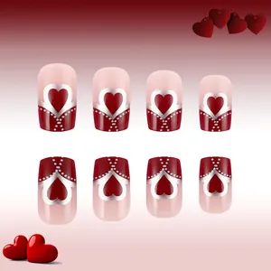 Detail of red heart and silver dot medium square press-on nails for Valentine's