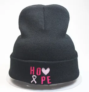 Black knit beanie featuring pink HOPE embroidery with heart and ribbon detail