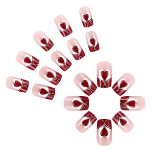 Detailed set of medium square press-on nails with red hearts and silver dot accents