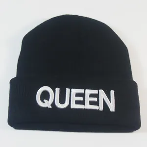 Classic black knitted beanie with white QUEEN embroidery, winter fashion trend for women