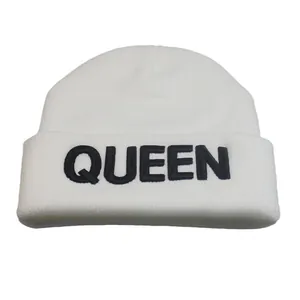White knit beanie for men and women with black QUEEN embroidery on a cuffed winter hat