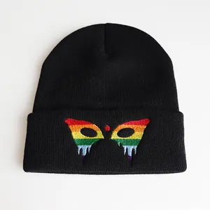 Black beanie with colorful embroidery featuring rainbow colors and a folded cuff