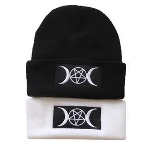 Goth style knitted beanies in black and white with triple moon goddess embroidery