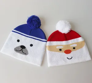 Detail of kids winter knit hats featuring polar bear and Santa Claus festive designs