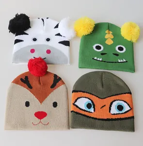 Detailed knit texture of assorted kids animal beanie hats with pom-poms for winter