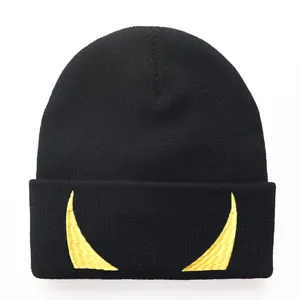 Black knit beanie with yellow devil horn embroidery in a classic hip-hop style design