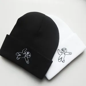 Black and white knitted beanies featuring high-quality voodoo doll embroidery patterns