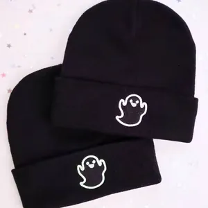 Two black knit beanies with ghost embroidery for winter outdoor sports and warmth