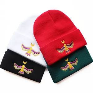 Winter Moon Bird embroidered knit beanies in four colors with soft warm texture