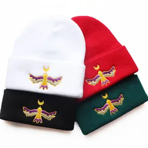 Winter Moon Bird embroidered knitted beanie hats in white, red, black and dark green