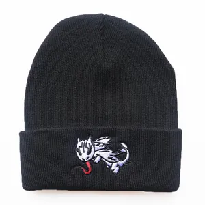 Black knit beanie with embroidered white dragon character from How to Train Your Dragon