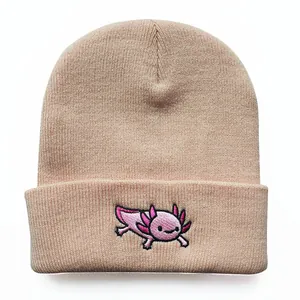 Close-up of pink axolotl embroidery on fine knit beanie with textured finish