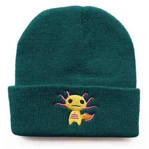 Dark green knitted beanie with a cute yellow Axolotl embroidery in a centered front view