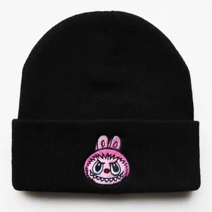 Unisex black knit beanie featuring pink cartoon monster embroidery for winter warmth