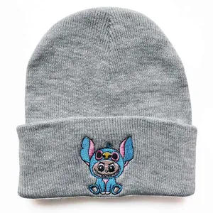 Close-up of Stitch embroidery detail on light gray ribbed knit beanie for winter