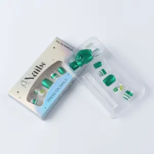 Detailed view of Saint Patrick's Day press-on nails with green clover and glitter patterns