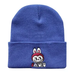 Close-up of navy blue ribbed knit beanie featuring detailed LABUBU cartoon embroidery
