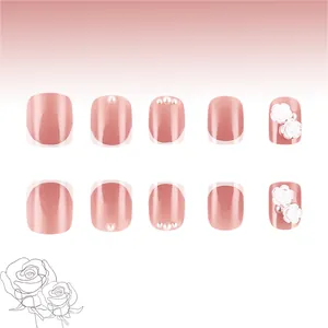 3D white rose and pearl accents on elegant pink French press-on nails with glossy finish