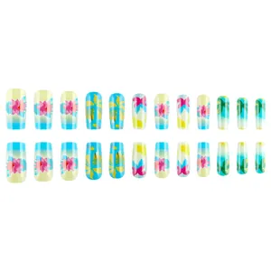 Tropical press-on nails set with vibrant lotus and palm tree art in glossy finish