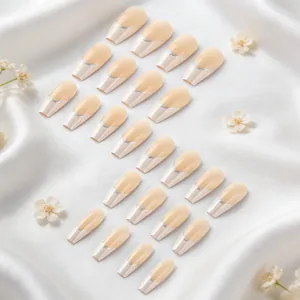 Detail of 24pcs nude pink French press-on nails with silver glitter lines and coffin shape