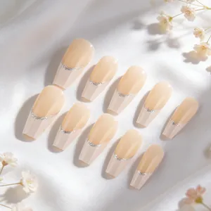 French press-on nails with nude base, silver glitter lines and long coffin shape