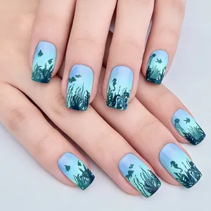 Short square press-on nails with blue-green gradient and sea life silhouette designs