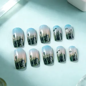 Short square press-on nails with blue-green seafoam gradient and seahorse art