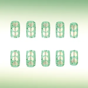 Glossy avocado green square press-on nails with golden heart design, 10 piece manicure set