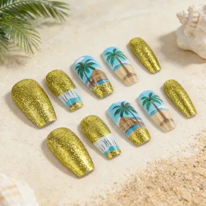 Tropical beach press-on nails with palm tree art and gold glitter in coffin shape